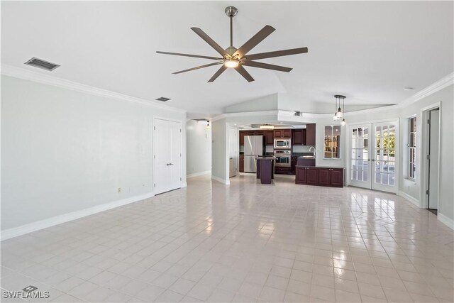 unfurnished living room with ornamental molding, vaulted ceiling, ceiling fan, and french doors