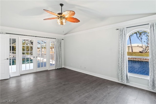 spare room with french doors, dark hardwood / wood-style floors, vaulted ceiling, and a wealth of natural light