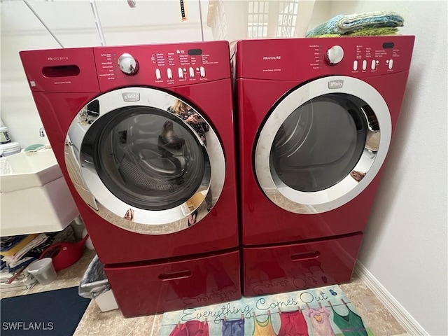 laundry area with separate washer and dryer