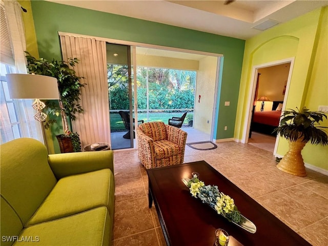 tiled living room with a wealth of natural light