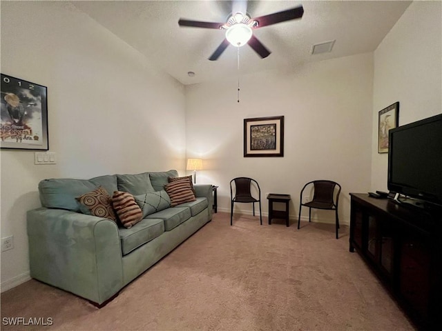 carpeted living room with vaulted ceiling and ceiling fan