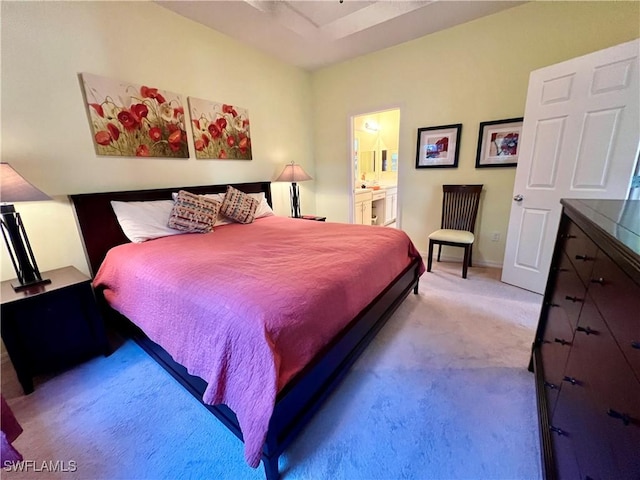 carpeted bedroom featuring ensuite bathroom