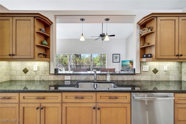 kitchen with dishwasher, ceiling fan, sink, tasteful backsplash, and dark stone counters