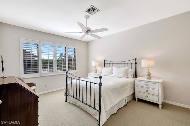 bedroom featuring ceiling fan and light carpet