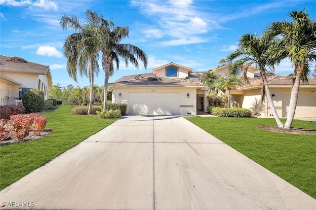 view of front of home with a garage and a front yard