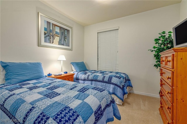 bedroom with light colored carpet