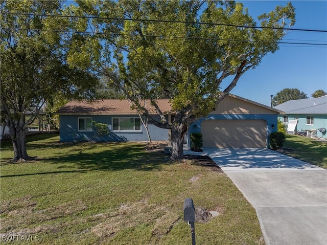 ranch-style house featuring a garage and a front lawn