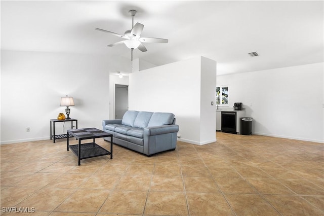 tiled living room with vaulted ceiling and ceiling fan