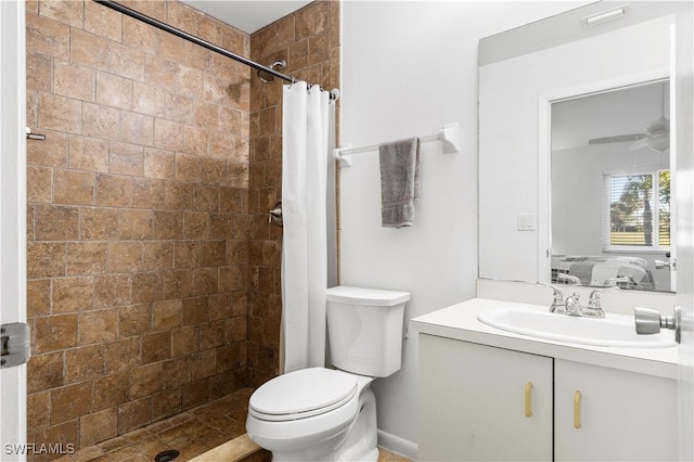 bathroom featuring vanity, ceiling fan, a shower with shower curtain, and toilet