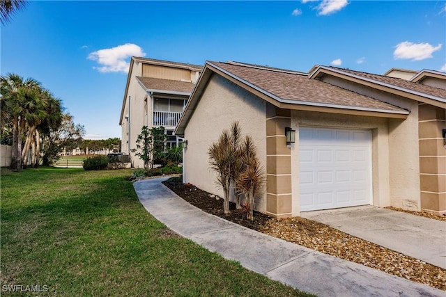 view of side of property featuring a yard and a garage