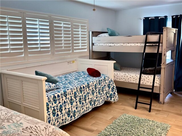 bedroom with light hardwood / wood-style floors