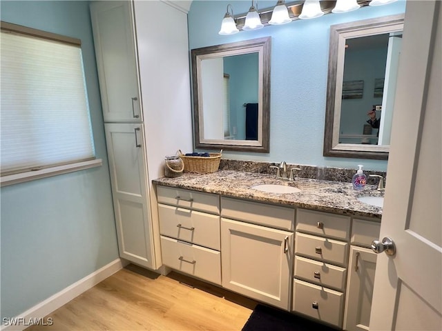 bathroom featuring vanity and hardwood / wood-style flooring