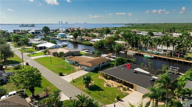 birds eye view of property with a water view