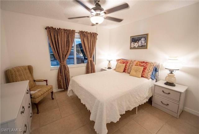 bedroom with light tile patterned floors and ceiling fan