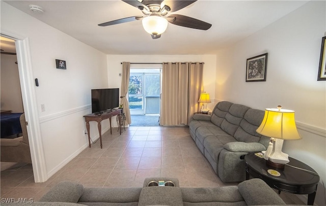 tiled living room featuring ceiling fan