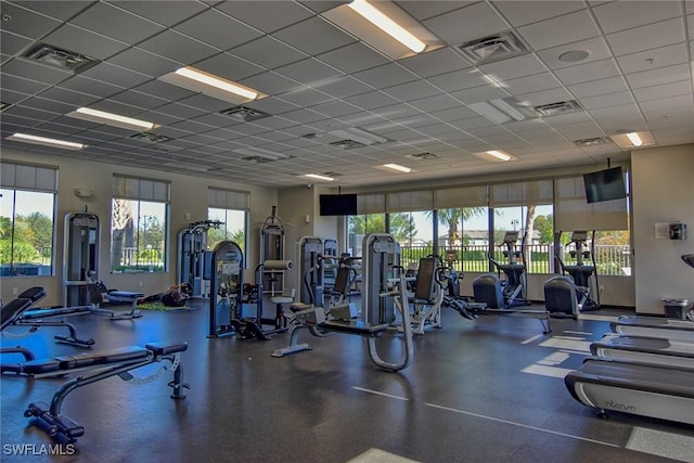 workout area featuring a paneled ceiling