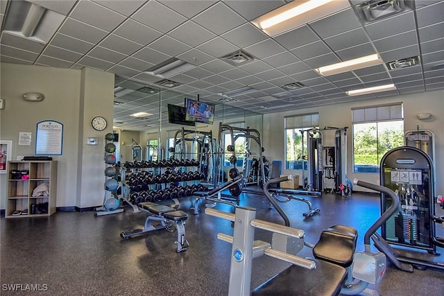 exercise room with a drop ceiling