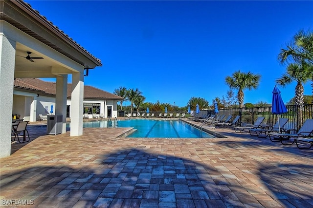 view of pool featuring a patio area and ceiling fan