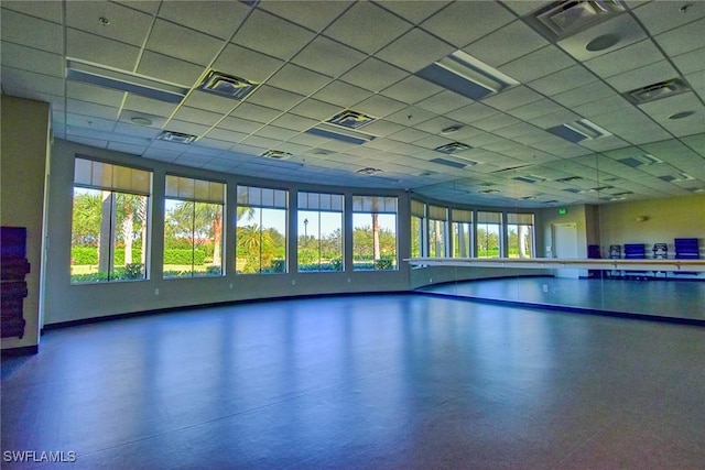 game room featuring a paneled ceiling