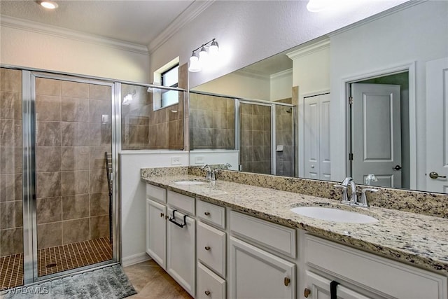 bathroom featuring vanity, crown molding, and walk in shower