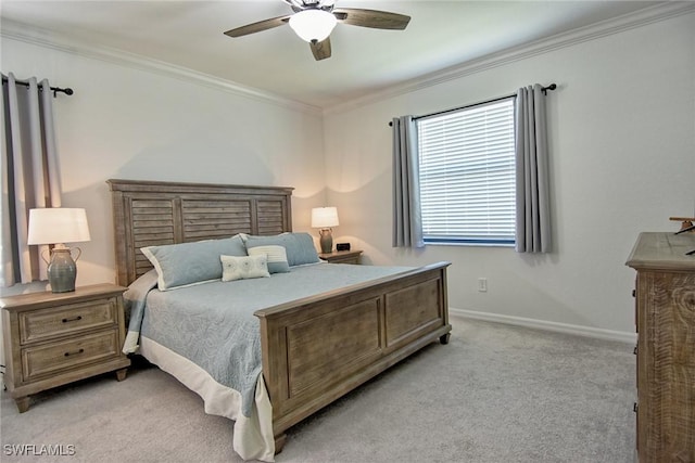 bedroom featuring ceiling fan, light colored carpet, and crown molding