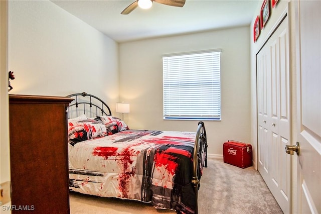 bedroom featuring light carpet, a closet, and ceiling fan