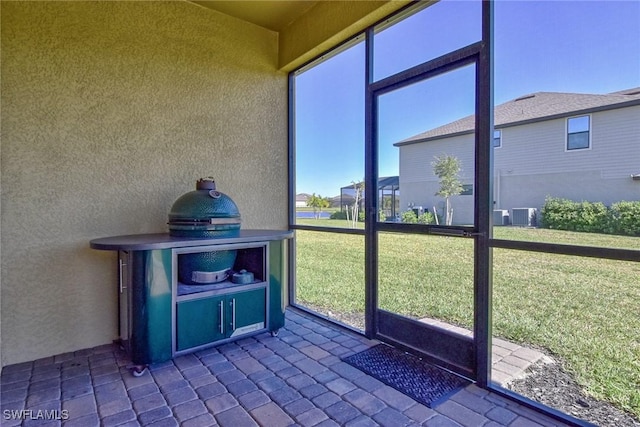 unfurnished sunroom with plenty of natural light