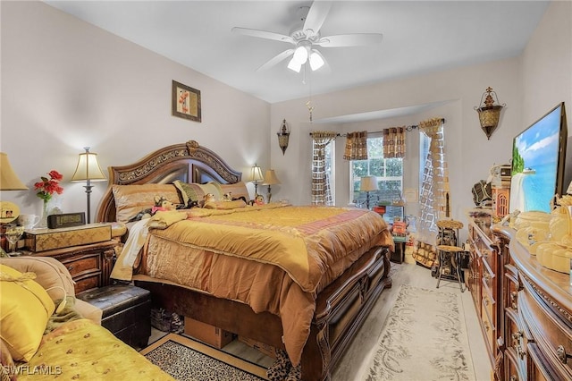 bedroom with ceiling fan and light hardwood / wood-style flooring