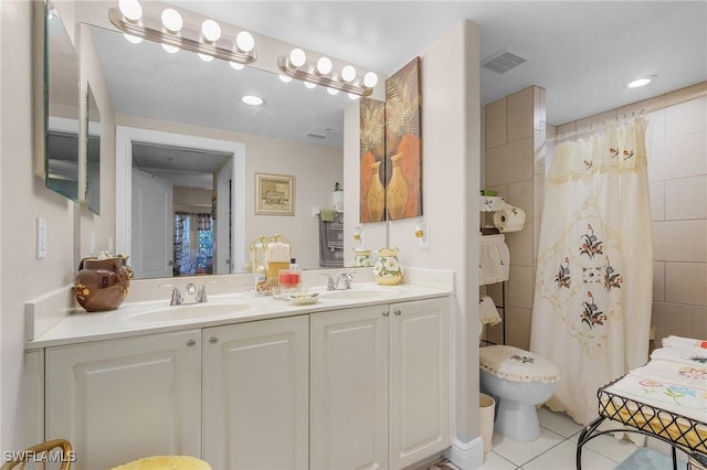 bathroom featuring tile patterned flooring, vanity, a shower with shower curtain, and toilet