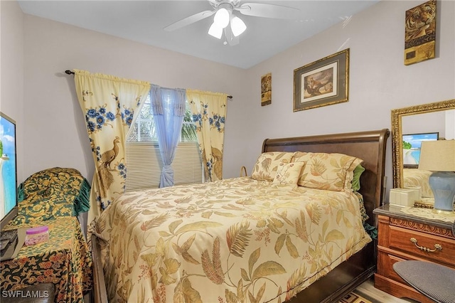 bedroom with hardwood / wood-style flooring and ceiling fan