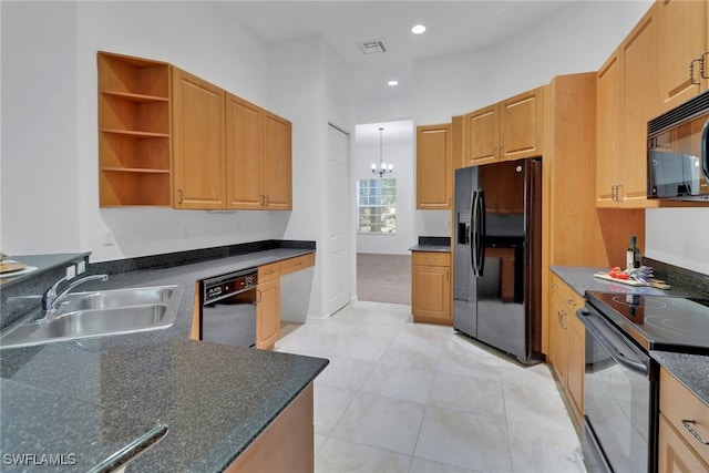 kitchen featuring sink, black appliances, decorative light fixtures, a chandelier, and light tile patterned flooring