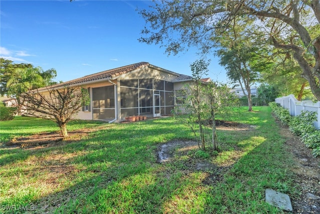 view of yard featuring a sunroom