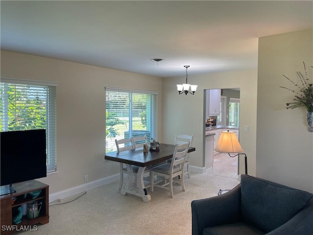 dining area with a chandelier