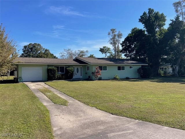 single story home featuring a garage and a front lawn