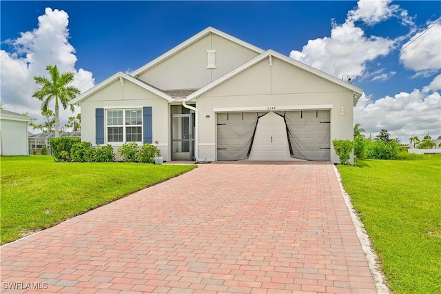 view of front of home featuring a garage and a front yard