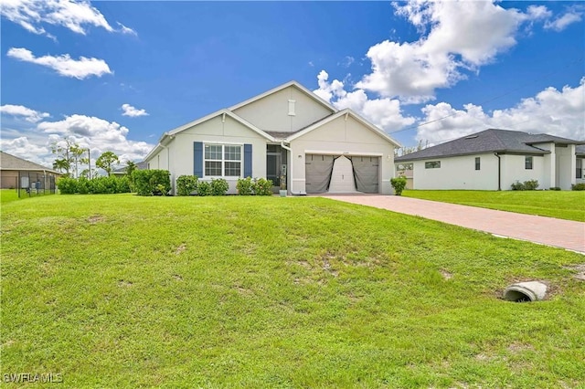 view of front facade with a garage and a front lawn