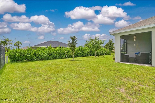 view of yard with a sunroom