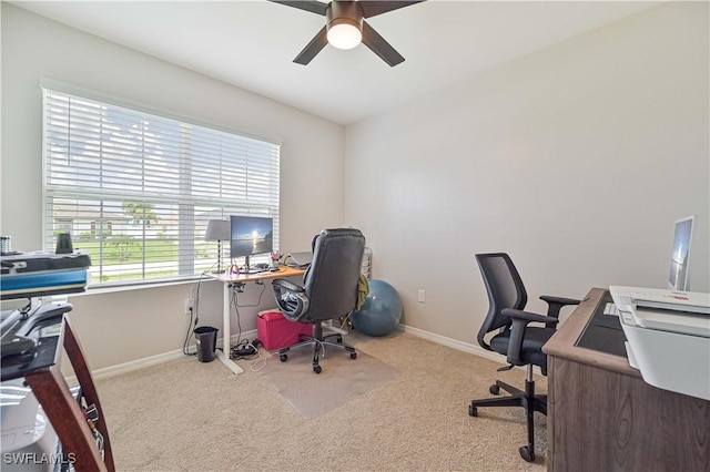 office area featuring ceiling fan and light carpet