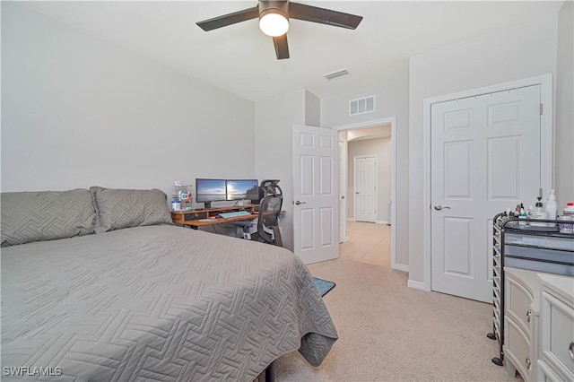 bedroom featuring ceiling fan and light carpet