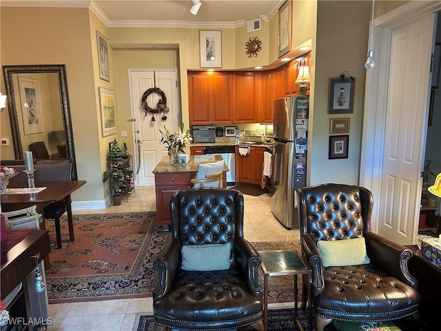 kitchen with crown molding, light tile patterned floors, and appliances with stainless steel finishes