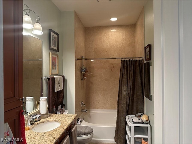 full bathroom featuring vanity, shower / bath combination with curtain, and toilet