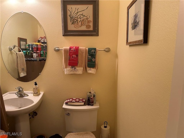 bathroom with toilet and sink