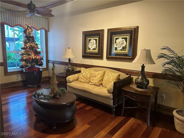 living area with ceiling fan and wood-type flooring