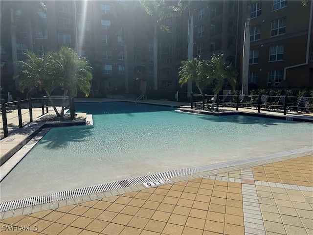 view of swimming pool with a patio