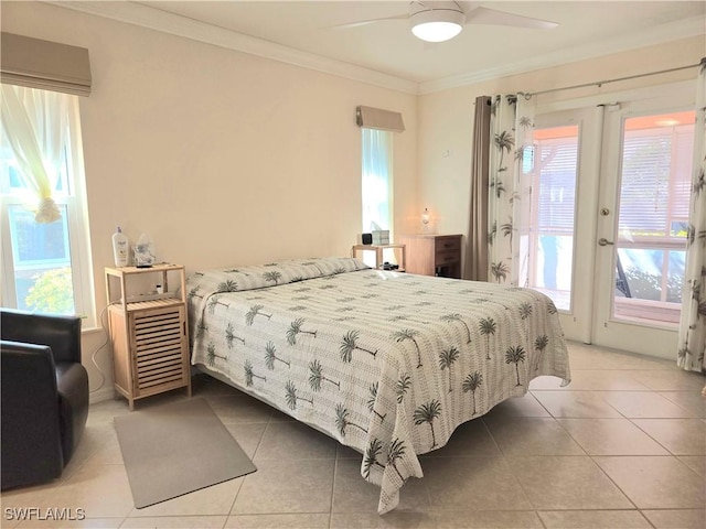 tiled bedroom featuring ceiling fan, crown molding, and french doors