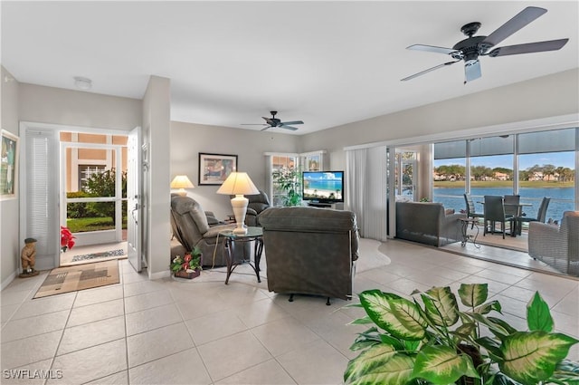 tiled living room featuring ceiling fan