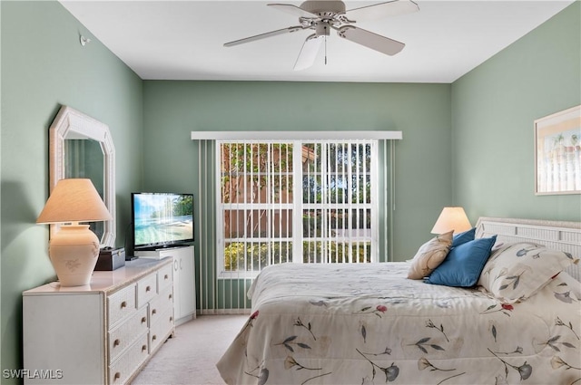 bedroom featuring ceiling fan and light carpet