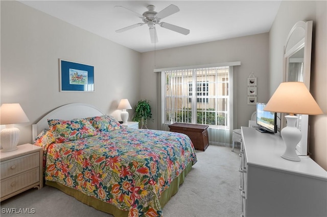 bedroom with ceiling fan and light colored carpet