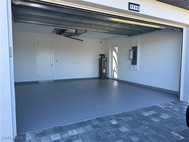 garage with electric panel, water heater, and a garage door opener