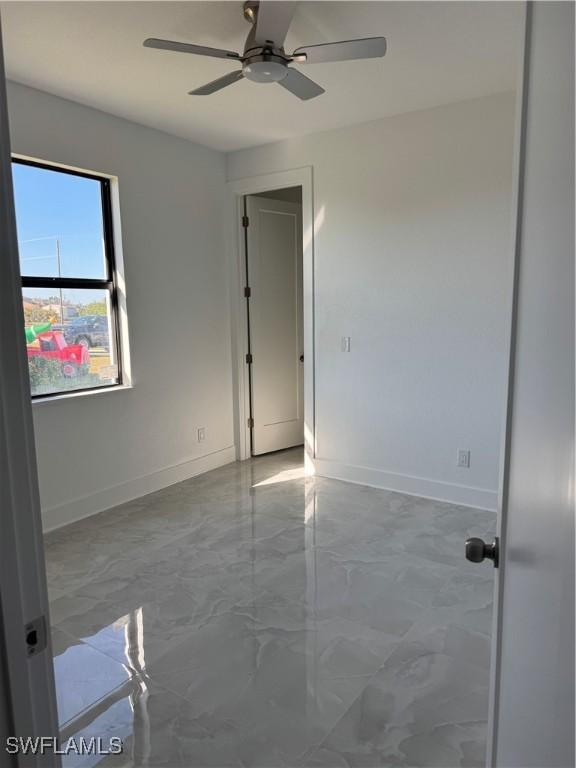 spare room featuring ceiling fan